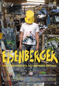 Eisenberger filmposter - Mann med malingsflekker på seg med bøtte over hode